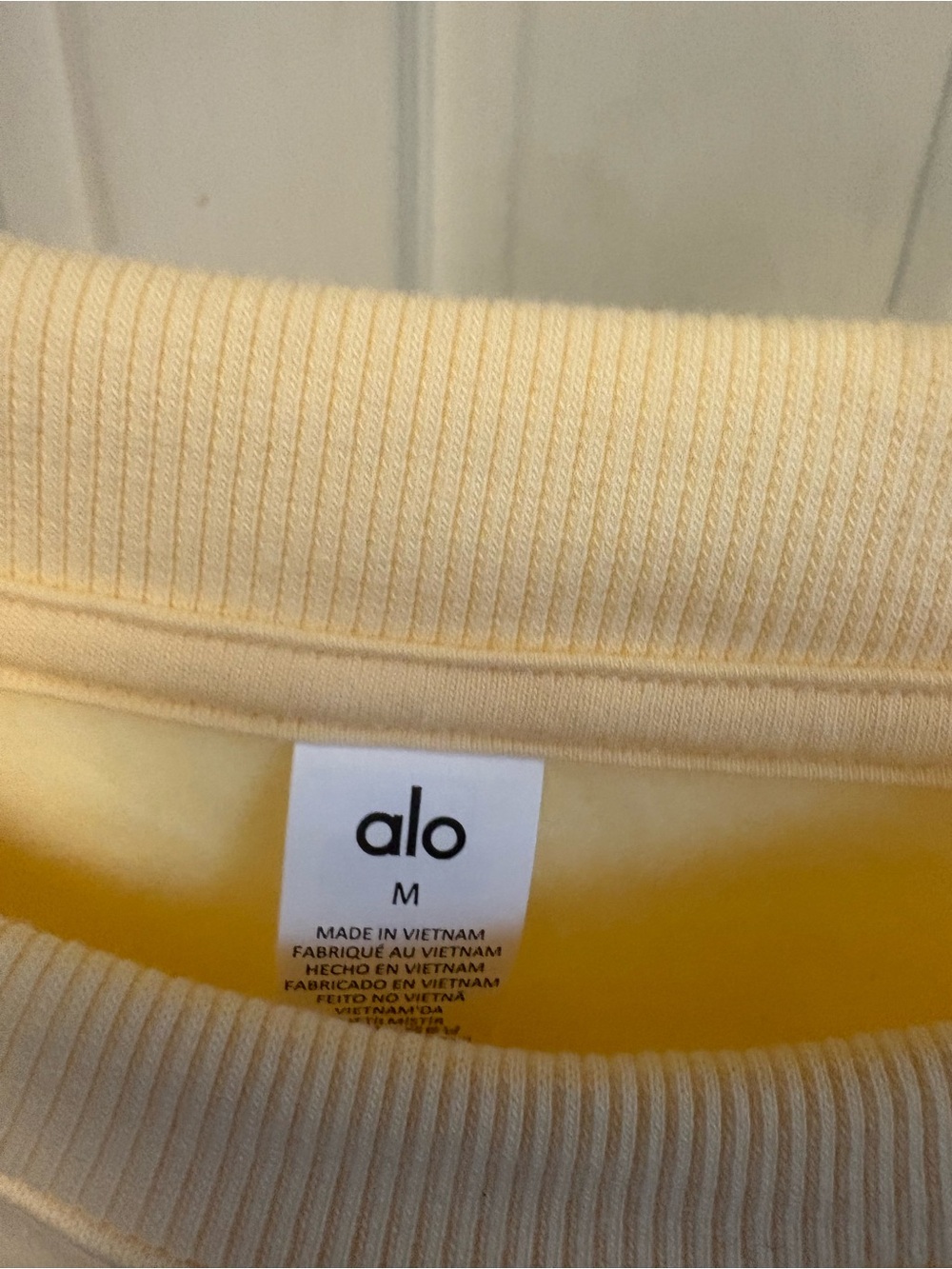 Alo Cropped Accolade Crewneck Sweatshirt in Soft Pale Yellow - Picture 6 of 7